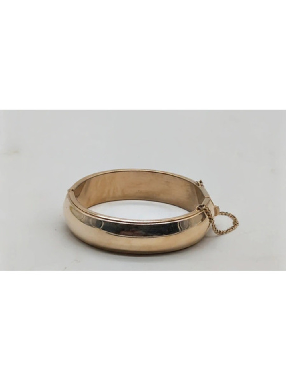 Vintage Gold Tone Hinged Bangle Bracelet with Safety Chain
